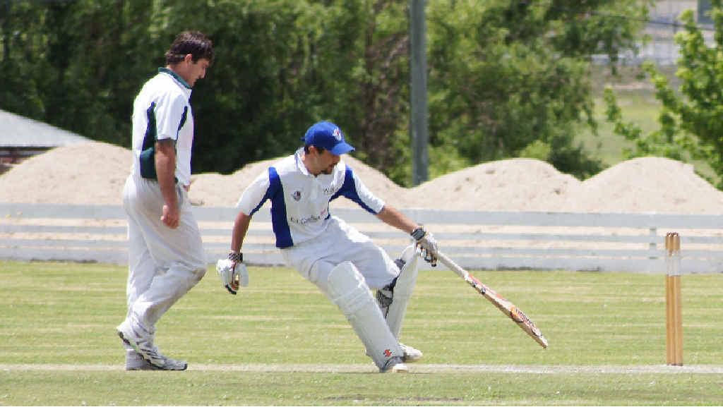 Warwick’s Kevin Poole decides whether or not to make a run for it after Stanthorpe’s Anthony Marino bowls. Warwick’s Kevin Poole decides whether or not to make a run for it after Stanthorpe’s Anthony Marino bowls.